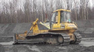 Komatsu D65PX-12 pushing cinder
