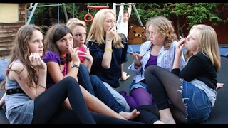 German Girl Smoking in Group