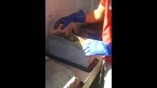 Ensaio de resistência à compressão de bloco de concreto