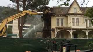 Demolition Claw Tears Apart House Facade