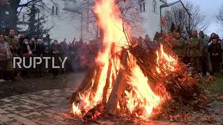 Serbia: Orthodox Christians celebrate Christmas Eve with oak log fire at Belgrade's Saint Sava