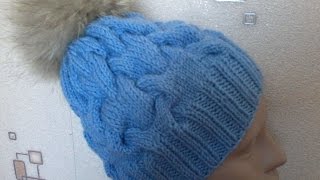 Вязание шапки с объемными  косами на спицах.Knitted hat with braids volume on the spokes.