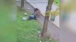 Mother reacts quickly as her child falls down a manhole