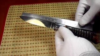 Нож складной с резной рукоятью из рога лося.