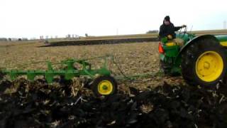 830 John Deere and 5 bottom plow