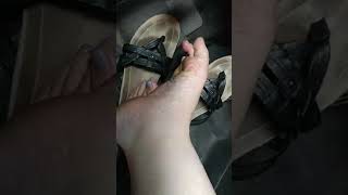 Girl showing her sweaty soles in the car