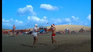 People walk naked on Maspalomas beach, Playa del Inglés