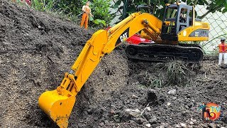 BRUDER TOYS EXCAVATORs CAT digging lake. Construction TRUCK