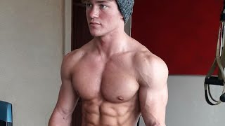 Young muscle boy flexing