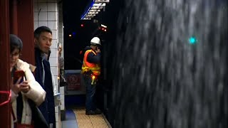 Raw: Rainstorm Floods New York Subways