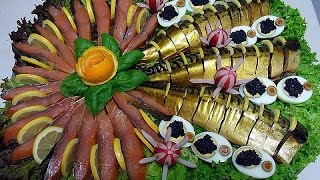 Красивая нарезка рыбы на тарелке. Праздничное оформление нарезки