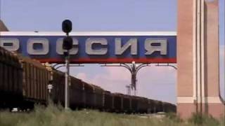 The Russian railway wide gauge (1520mm) Diesel Locomotive 2TЭ10M-4971 haul the long freight train
