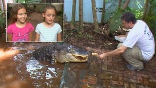 Father Lets His Brave 8-Year-Old Twin Daughters Feed Pet Alligator