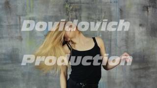 Girl teenager blonde dancing dance with her hair rotating her head
