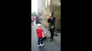 Busker ( magician - teasing kid ) in Edinburgh 2013.08.11