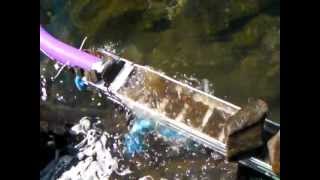 Gravity dredge sluice end