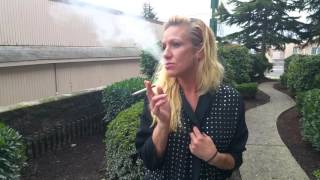 Bella smokes outside