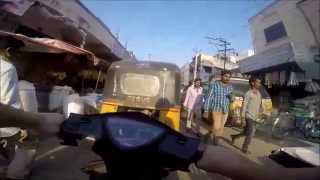 Riding scooter to the chicken slaughter house in Guntur, Andhra Pradesh, india