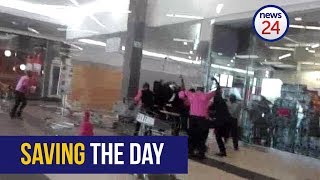 WATCH: Trolley-wielding Game staff fight off looters