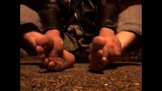 Late night foot rub in the park, boots & socks