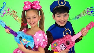 Sasha plays Toy Guitar Music Challenge and sing Kids Nursery rhymes Songs