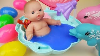 Baby doll Dolphin swim and Surprise eggs Slime Shellfish bath toys