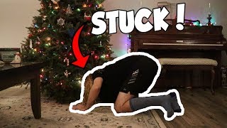 STEP SIS GETS STUCK UNDER THE CHRISTMAS TREE