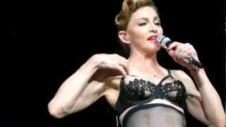 "MADONNA shows her NIPPLE while teasing a concert audience!"  | WARNING: SEXUAL CONTENT