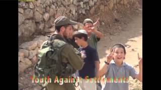 Settlers uprooting Palestinian fence