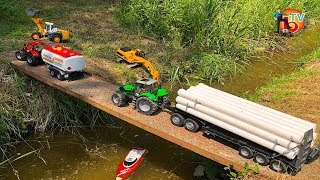 BRUDER RC TRACTOR Deutz pulls construction pipes! ट्रैक्टर खींचता है