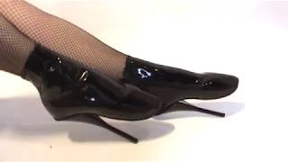Shiny black clothes and heels