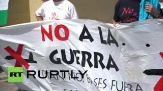 Spain: Protestors rally outside US Naval Station Rota during Obama's visit