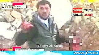 Боевики перед камерой отсекают голову священнику.