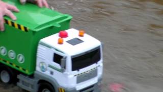 Toy Trash Truck driving through puddles!