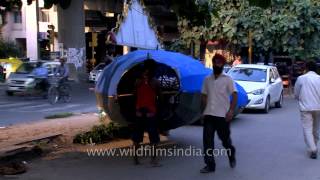 Effigy of Ravana carried by workers on street : at Delhi