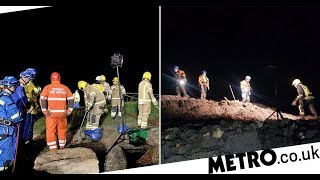 Police called to rescue people stuck in mud get trapped themselves