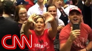 Trump supporters flip CNN the bird