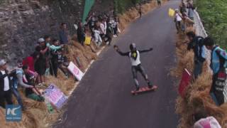 Going downhill at speed of 130km/h! Watch race of professional longboarders in China