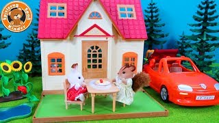 Sylvanian Families - Starter Haus und Cabrio Auto - Spielzeug für Kinder deutsch