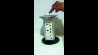 Motorised pop up socket