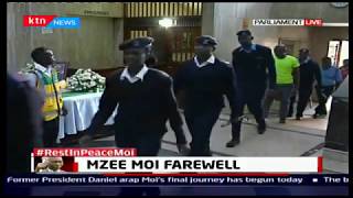Both police and the public pay their last respect to mzee Moi at parliament buildings