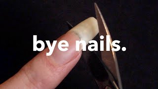 Cutting off my long natural nails... again.