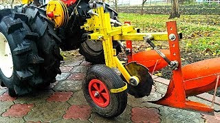 МОТОБЛОК НА КРУТЫХ КОЛЕСАХ БУКСУЕТ С ПЛУГОМ?