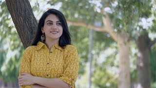 Smiling Indian girl enjoying beautiful morning weather in a ga... | Indian Stock Footage | Knot9