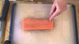 Slicing fish for sashimi and nigiri