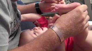 Daddy tickling Aiden's feet