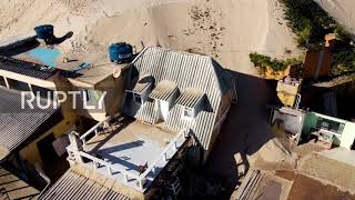 Advancing sand dunes "swallow" houses in southern Brazil *DRONE FOOTAGE*