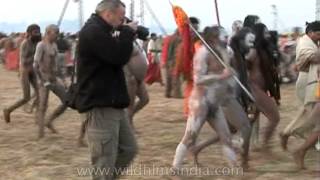 Naga sadhus running for the holy bath at Sangam during Ardh Kumbh, 2007