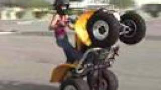 girl doing wheelies
