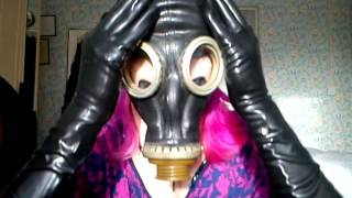 Gas Mask Girl Putting On Latex Gloves